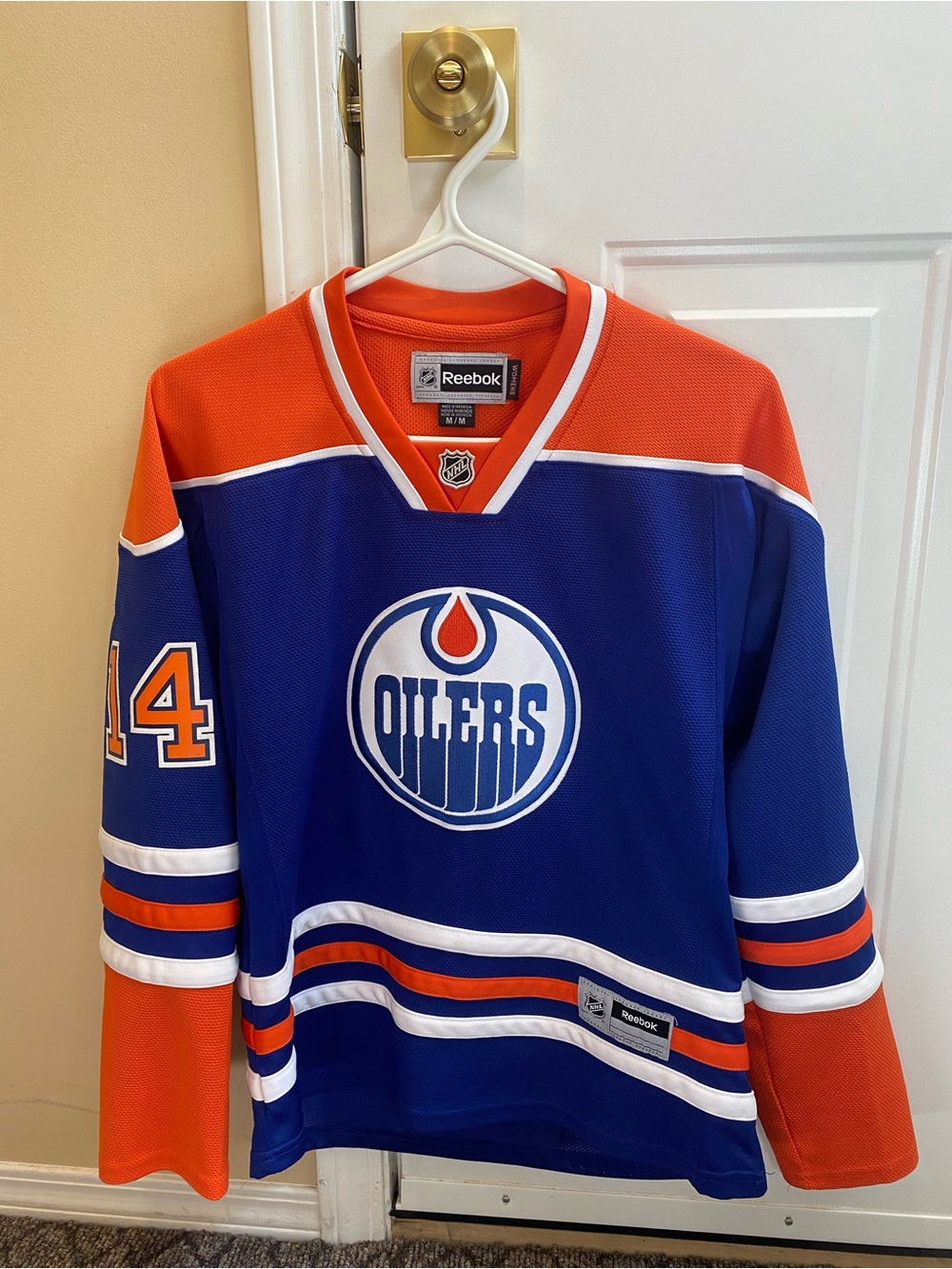 Jordan Eberle, Reebok Blue and Orange Edmonton Oilers Hockey Jersey.